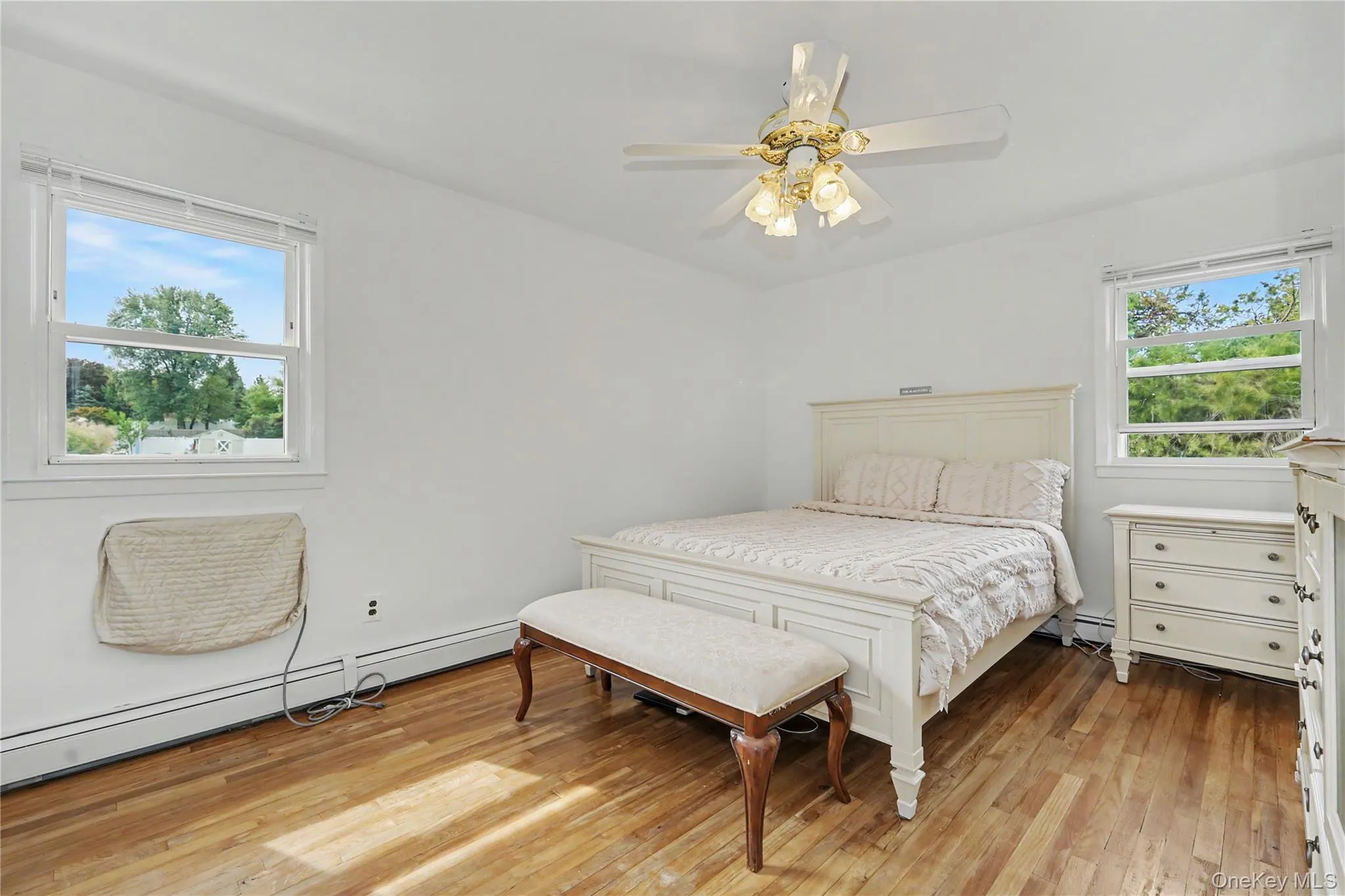 Substantially sized primary bedroom with great natural light and ceiling fan Substantially sized primary bedroom with great natural light and ceiling fan
