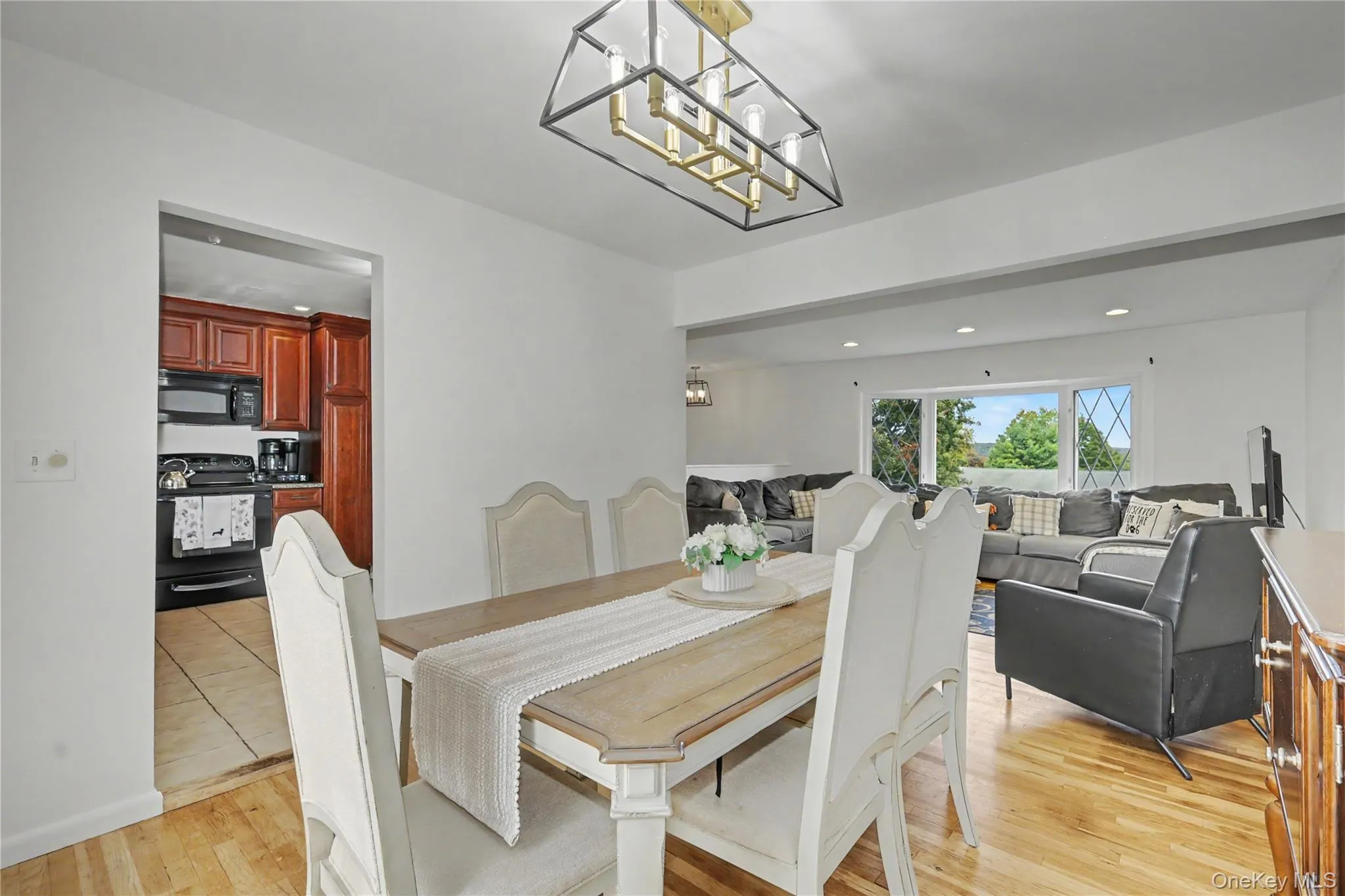Cheerful dining room with open floor plan to living room Cheerful dining room with open floor plan to living room