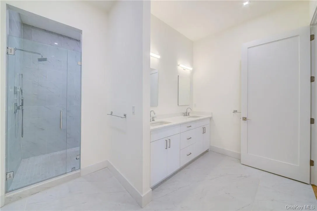 Bathroom with a shower with shower door and vanity Bathroom with a shower with shower door and vanity