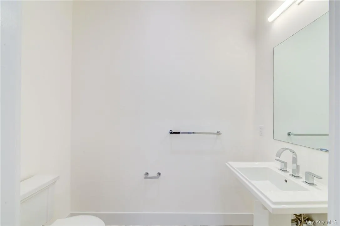 Bathroom with toilet and sink Bathroom with toilet and sink