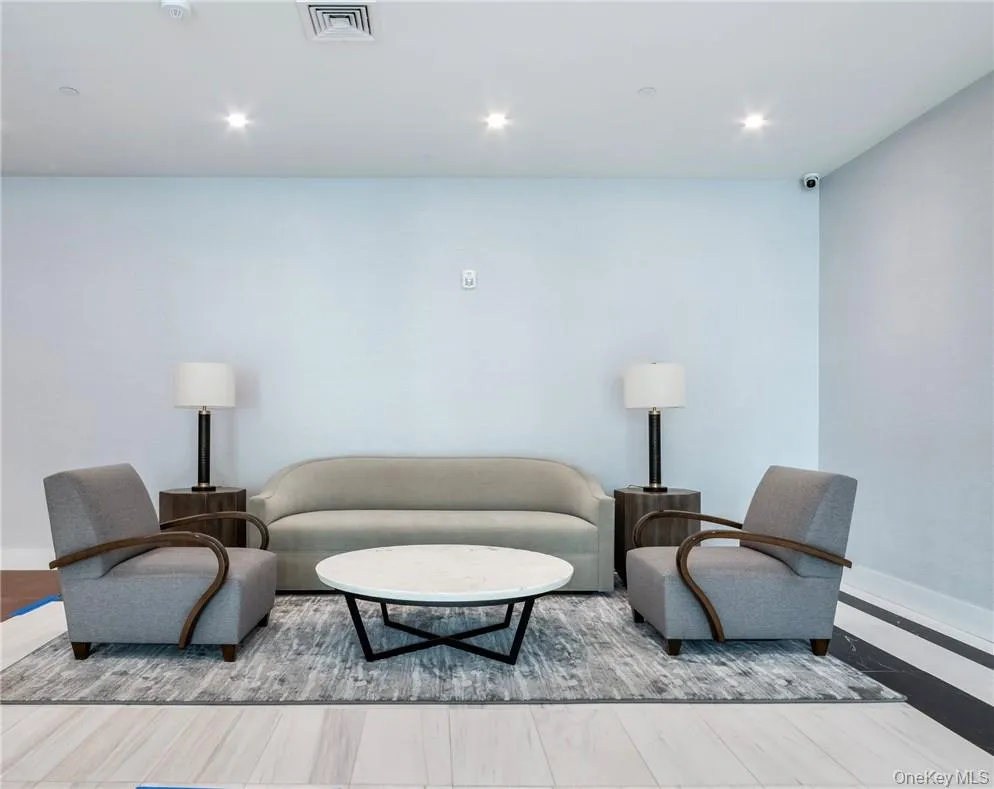 Living room featuring hardwood / wood-style flooring Living room featuring hardwood / wood-style flooring