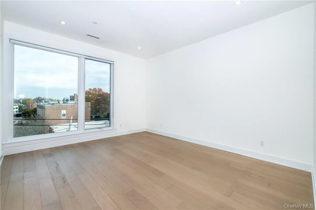 Empty room featuring hardwood / wood-style flooring Empty room featuring hardwood / wood-style flooring