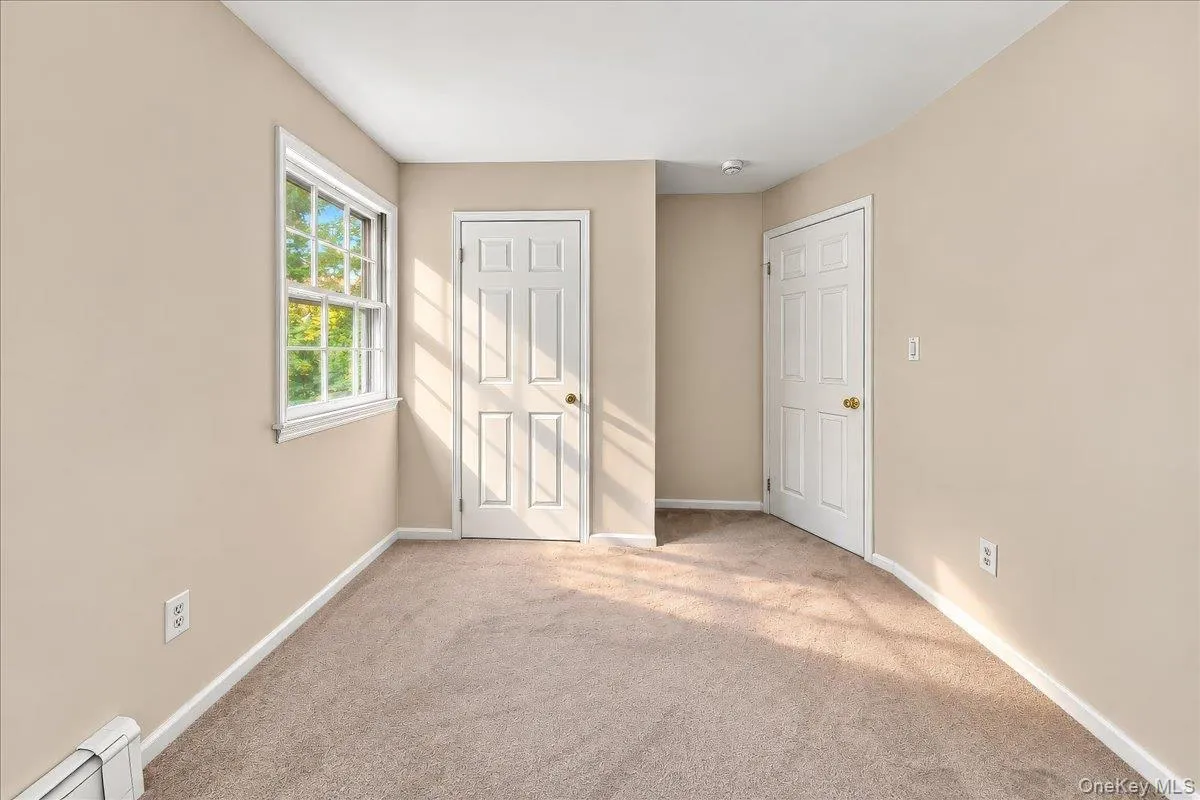 Bright, refreshed bedroom featuring brand-new carpeting and a fresh coat of paint, creating a clean and inviting space. Bright, refreshed bedroom featuring brand-new carpeting and a fresh coat of paint, creating a clean and inviting space.