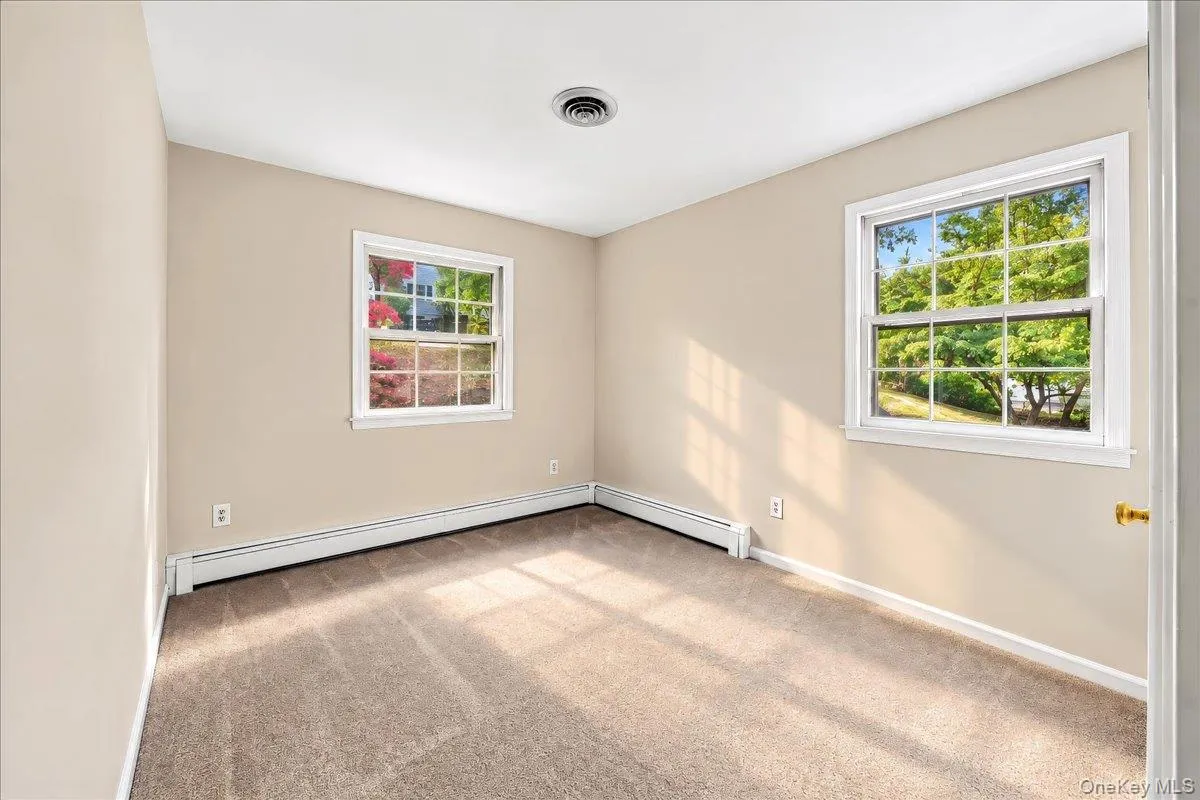 Bright, refreshed bedroom featuring brand-new carpeting and a fresh coat of paint, creating a clean and inviting space. Bright, refreshed bedroom featuring brand-new carpeting and a fresh coat of paint, creating a clean and inviting space.