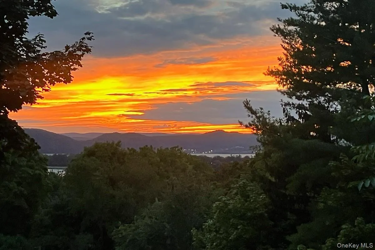 Enjoy beautiful Hudson River sunset views from the dining room, or step out onto the spacious deck for outdoor dining, entertaining, and taking in the stunning scenery. Enjoy beautiful Hudson River sunset views from the dining room, or step out onto the spacious deck for outdoor dining, entertaining, and taking in the stunning scenery.
