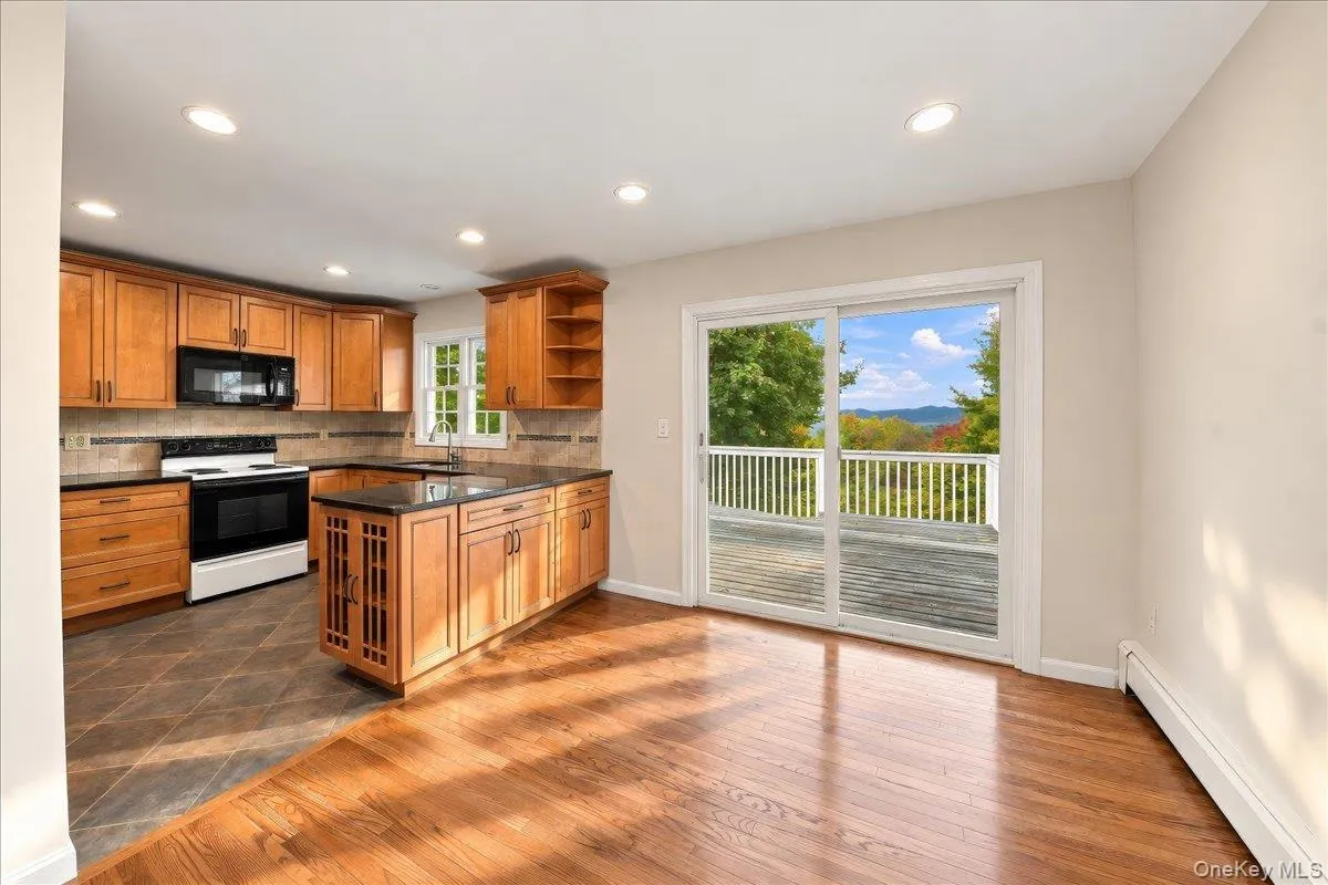 Open-concept kitchen seamlessly connected to the dining room, creating an inviting flow for everyday living and entertaining. Open-concept kitchen seamlessly connected to the dining room, creating an inviting flow for everyday living and entertaining.