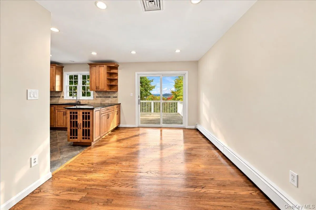 Bright dining room featuring sliding glass doors that open to the deck, where you can enjoy beautiful Hudson River views. Bright dining room featuring sliding glass doors that open to the deck, where you can enjoy beautiful Hudson River views.