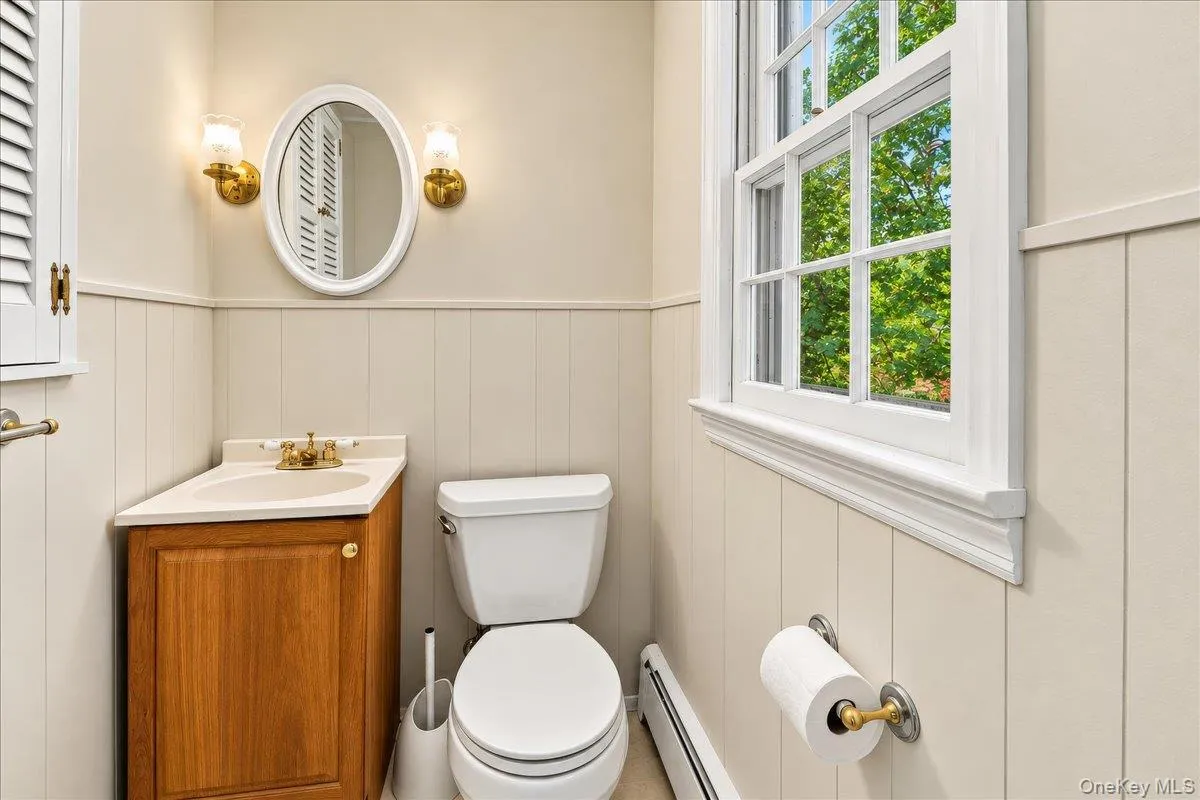 Conveniently located and updated lower-level half bath, easily accessible from both the recreation room and family room. Conveniently located and updated lower-level half bath, easily accessible from both the recreation room and family room.