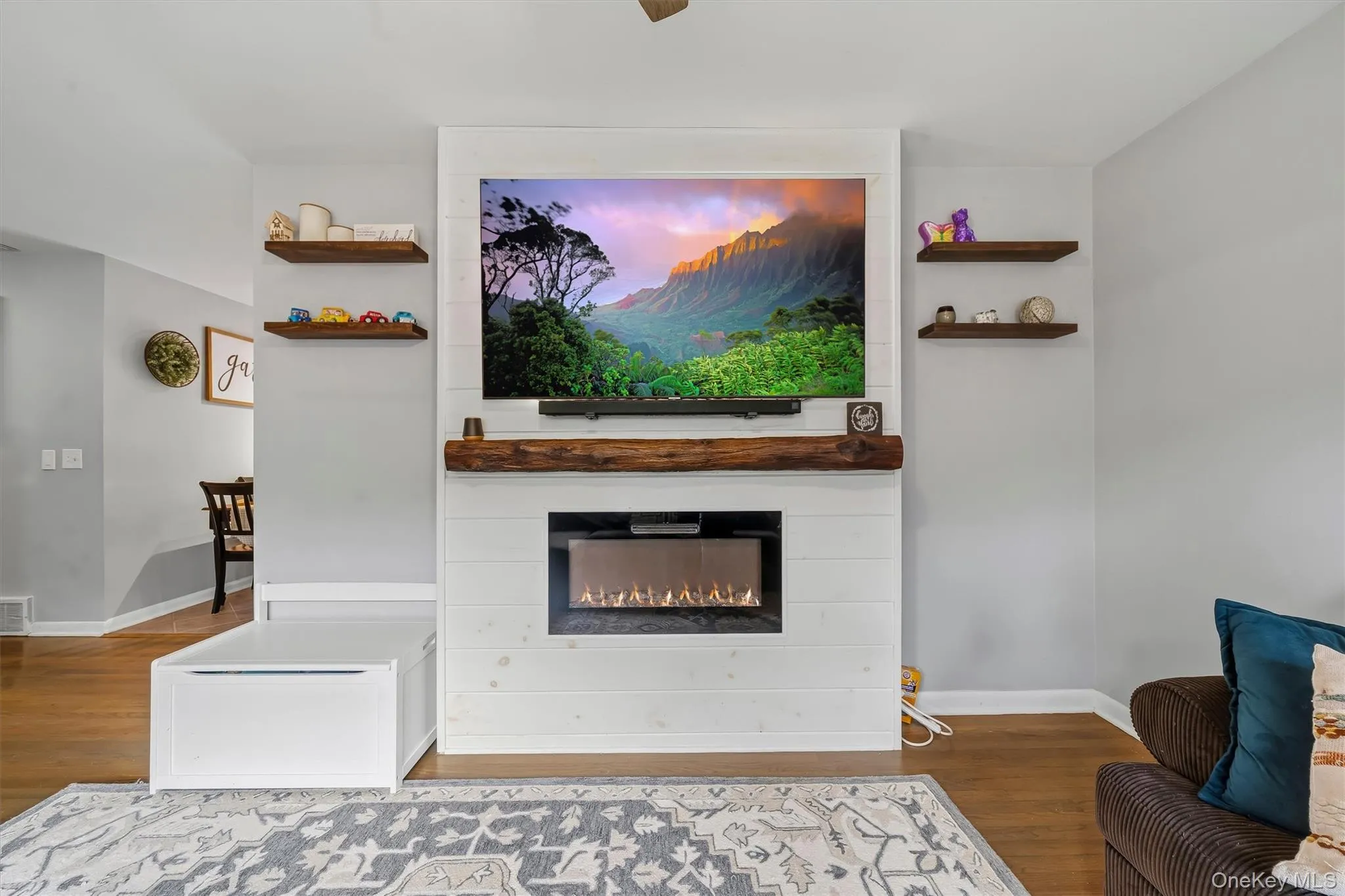 Shiplap fireplace surround with a substantial wood mantel Shiplap fireplace surround with a substantial wood mantel