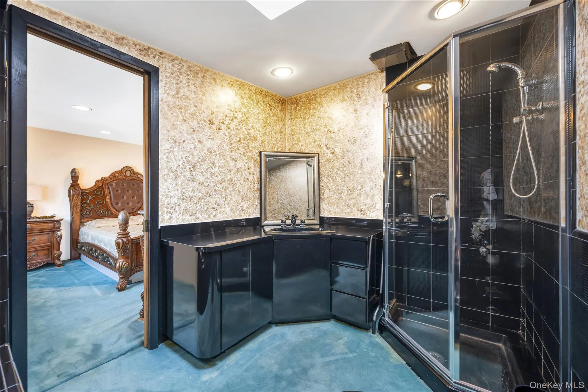 Ensuite bathroom with vanity, a stall shower, recessed lighting, and concrete floors Ensuite bathroom with vanity, a stall shower, recessed lighting, and concrete floors