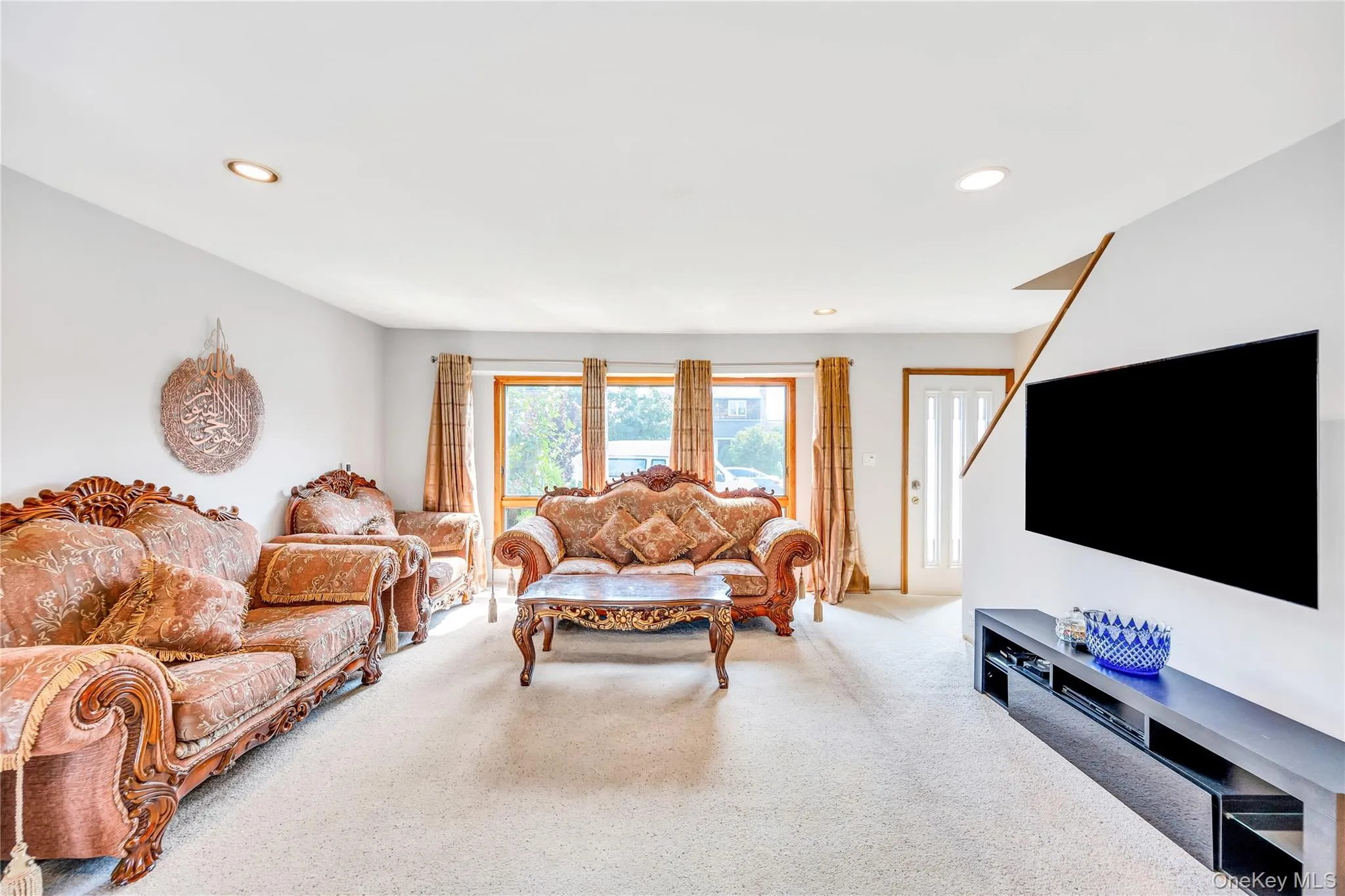 Living room with carpet flooring and recessed lighting Living room with carpet flooring and recessed lighting