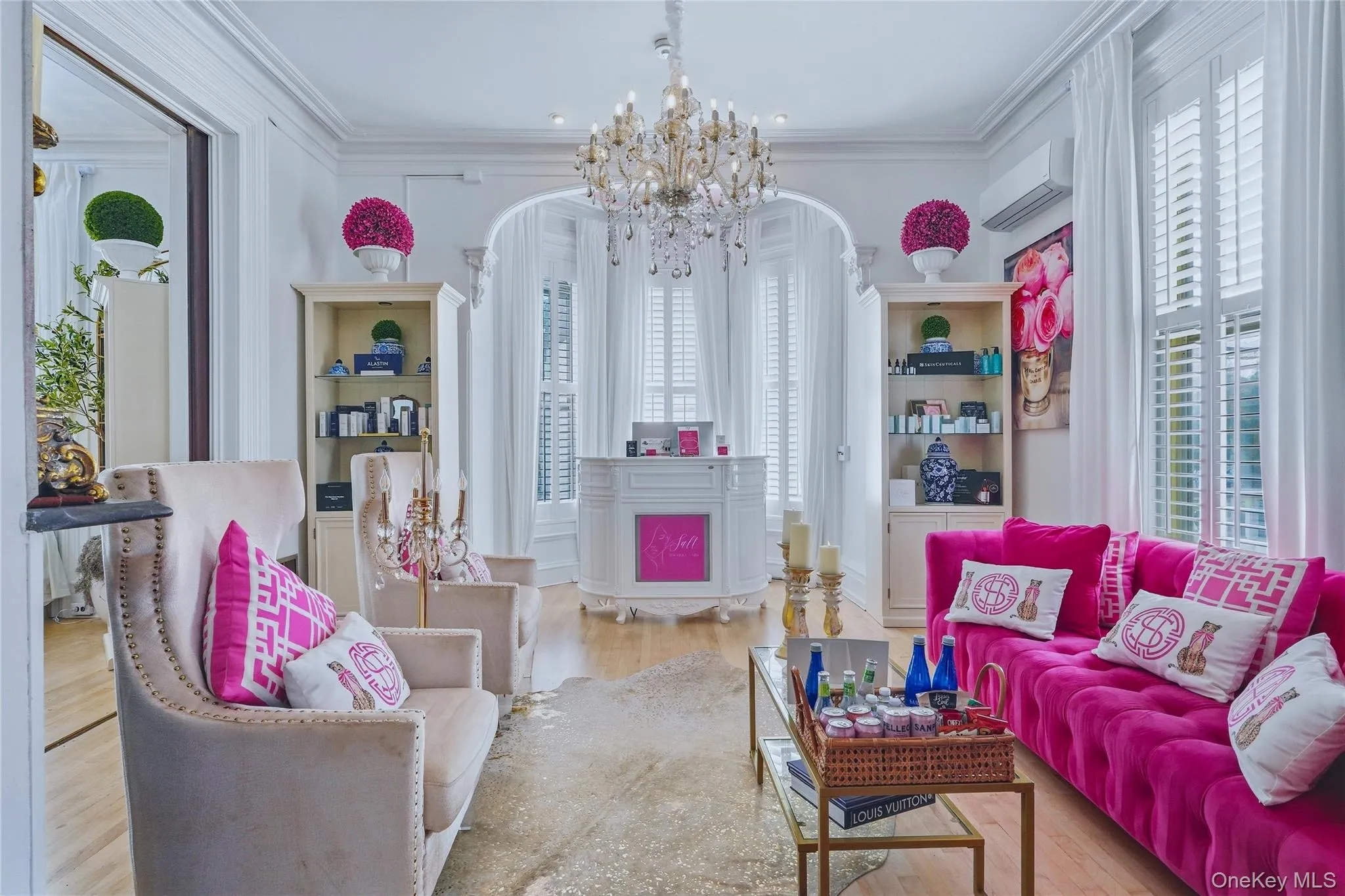 Hardwood flooring, crown molding, built-in display cabinetry, crystal chandelier, and interior shuttered windows Hardwood flooring, crown molding, built-in display cabinetry, crystal chandelier, and interior shuttered windows