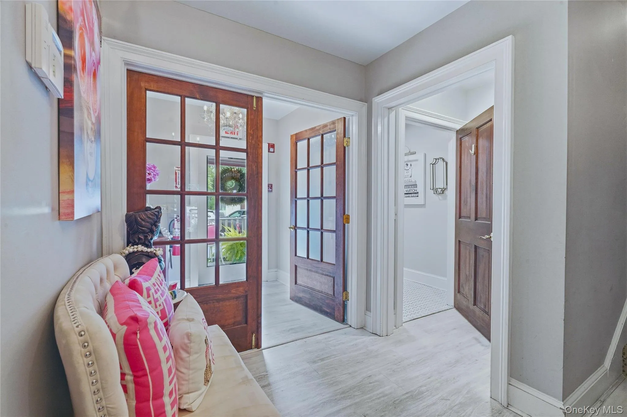 Entryway with Light-toned flooring, white trim, and light gray wall finishes Entryway with Light-toned flooring, white trim, and light gray wall finishes