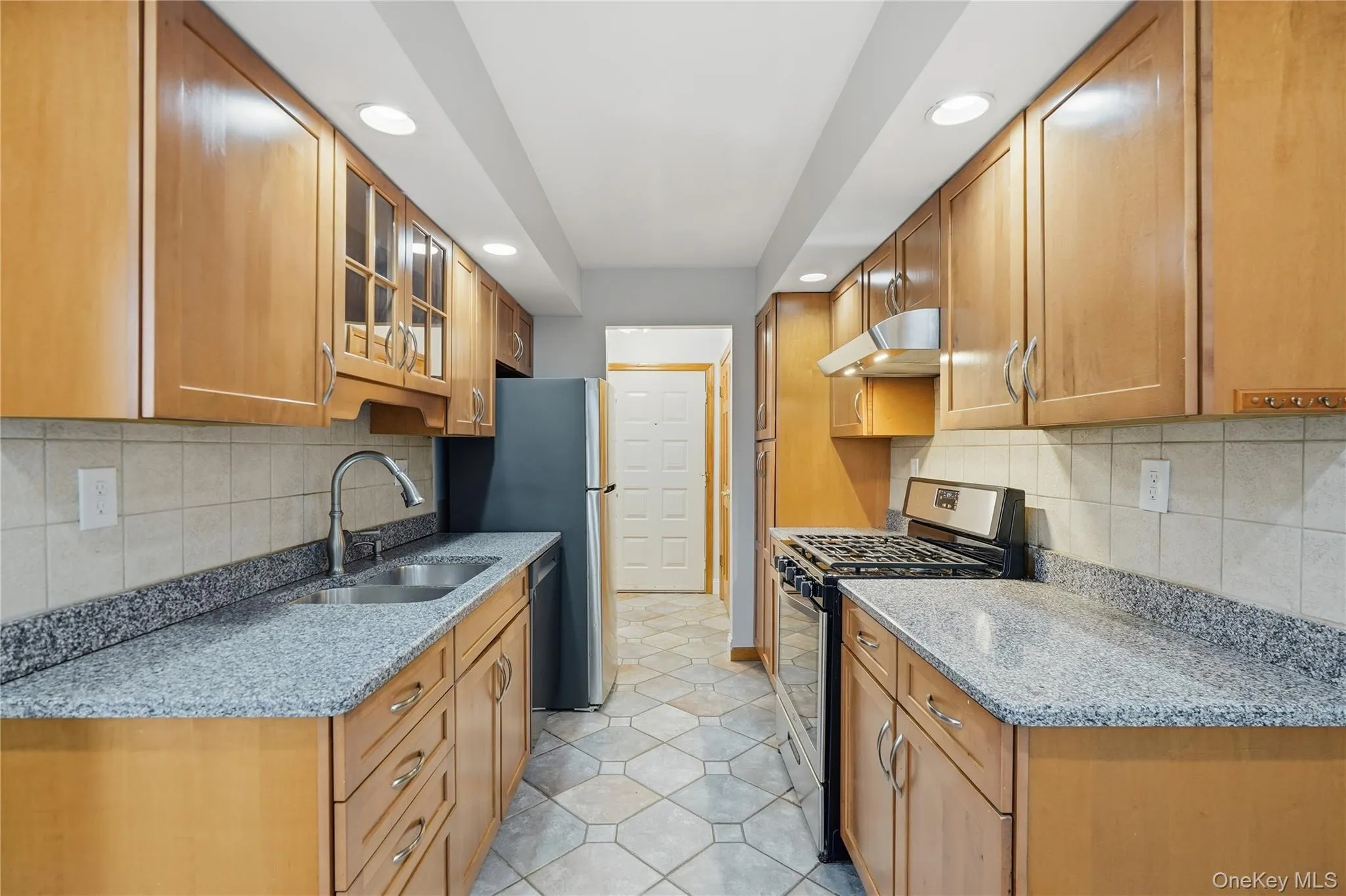 Kitchen with stainless steel appliances and granite countertops Kitchen with stainless steel appliances and granite countertops