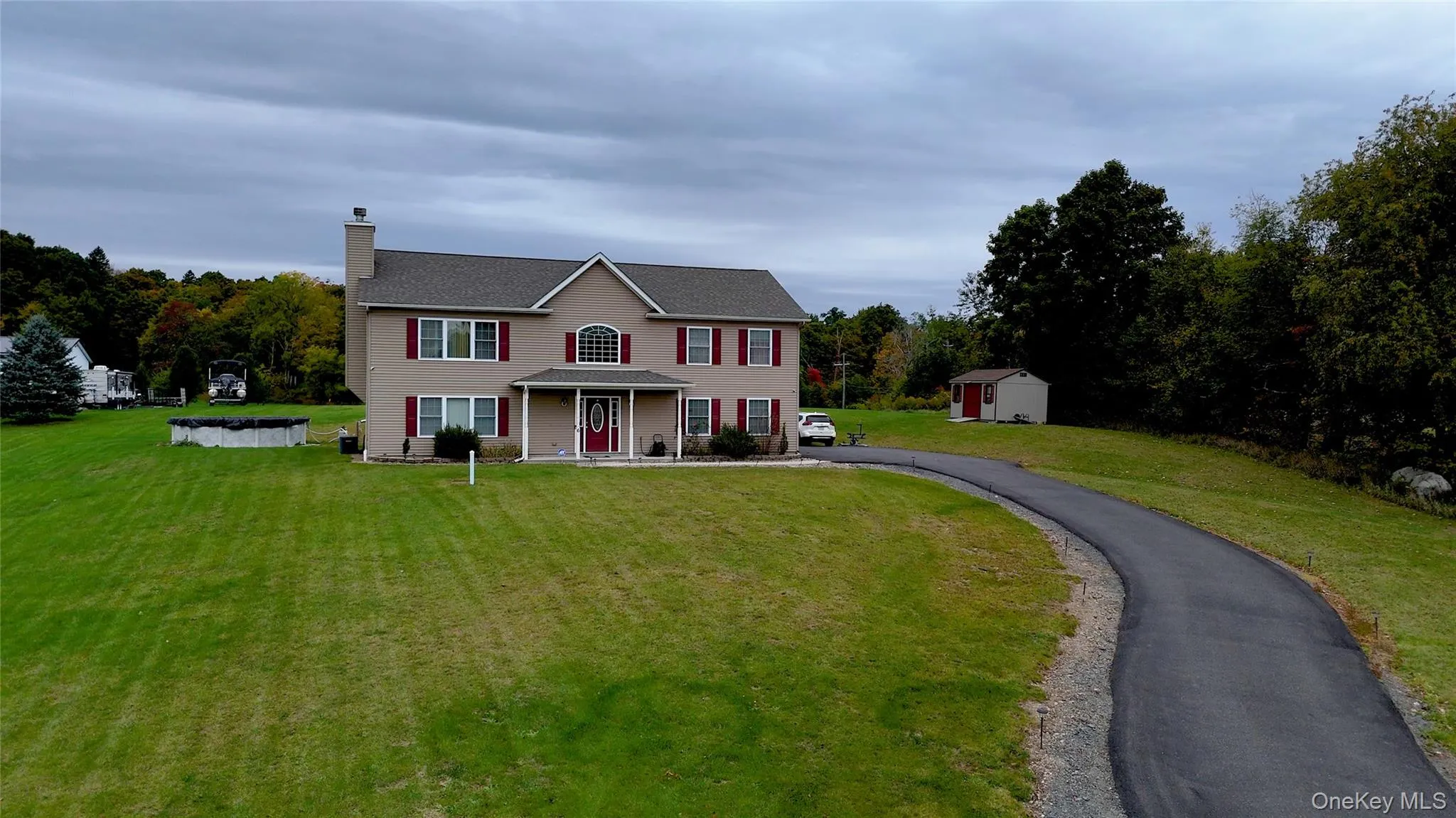large front yard with paved driveway large front yard with paved driveway