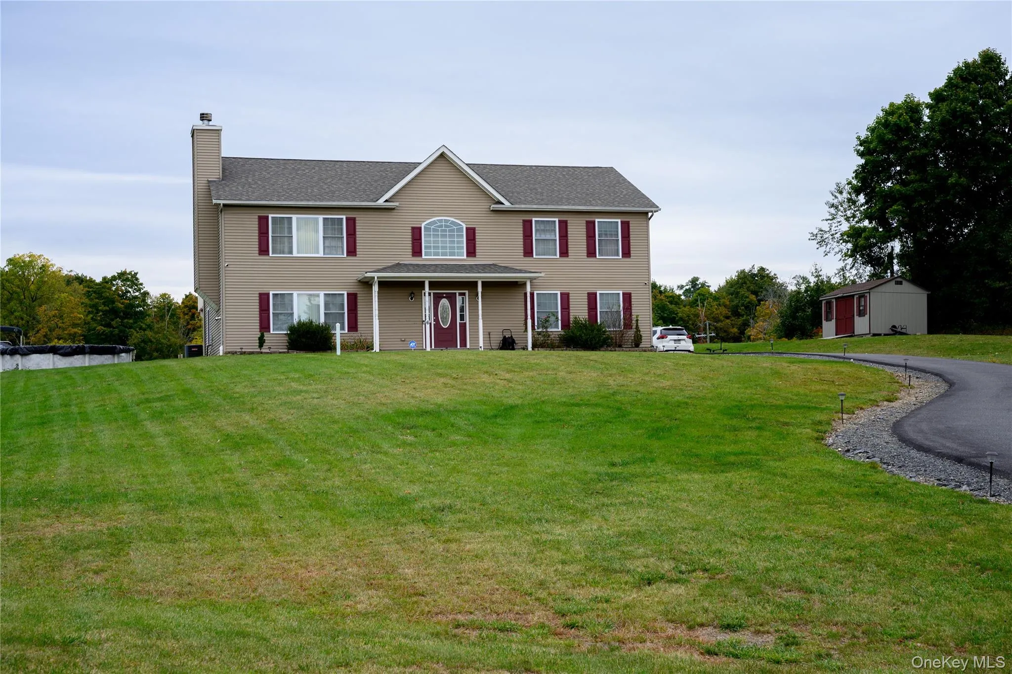large front yard with paved driveway large front yard with paved driveway