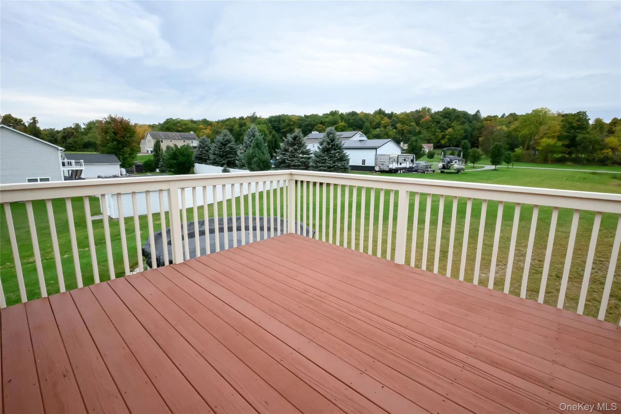 Deck that is accessed from the sliders in the dining room Deck that is accessed from the sliders in the dining room