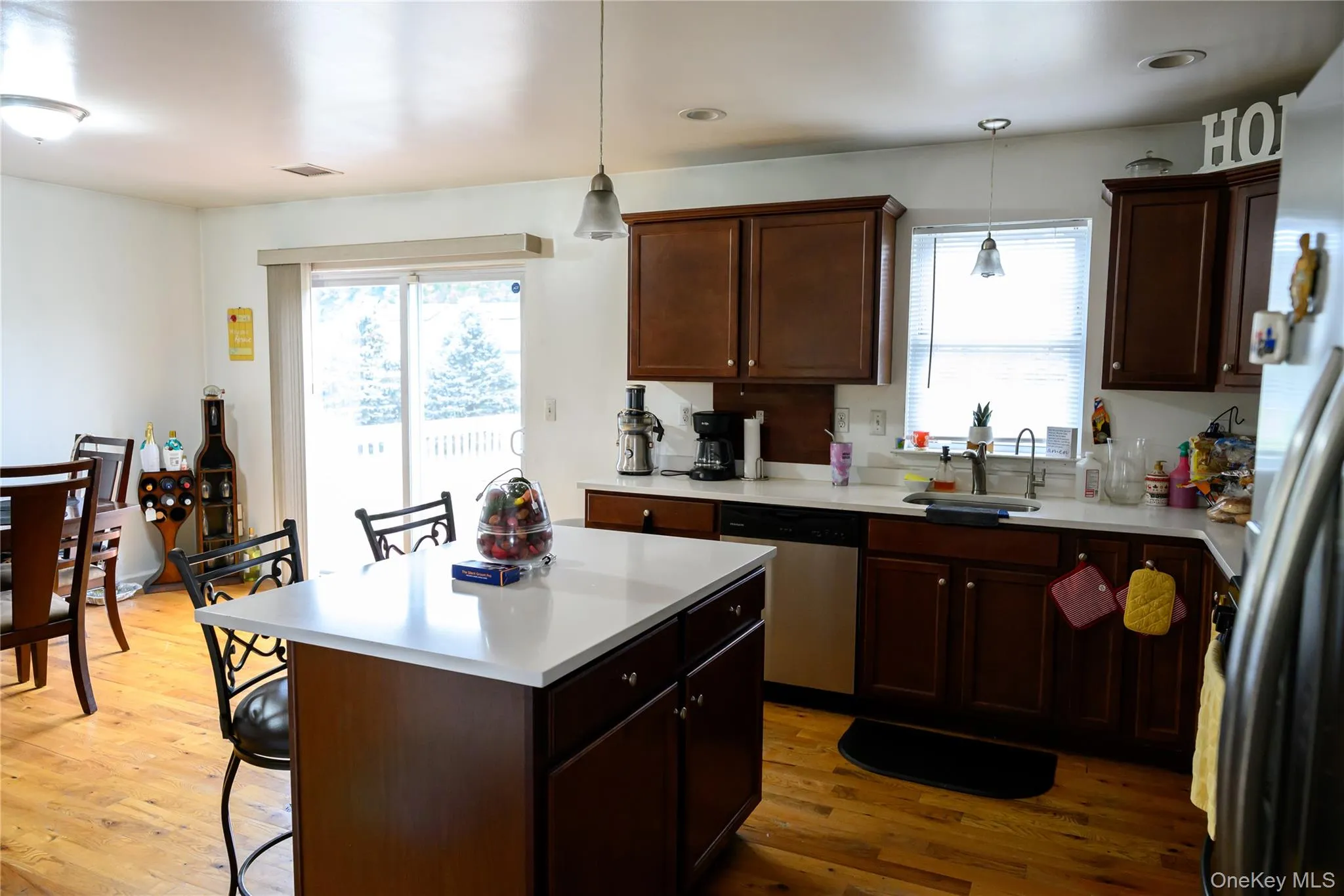 Kitchen wood cabinets, hardwood floors, granite counters and stainless steel appliances Kitchen wood cabinets, hardwood floors, granite counters and stainless steel appliances