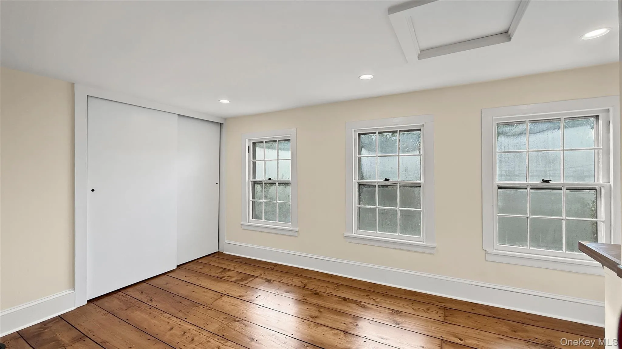 One bedroom upstairs with wide plank floors. One bedroom upstairs with wide plank floors.