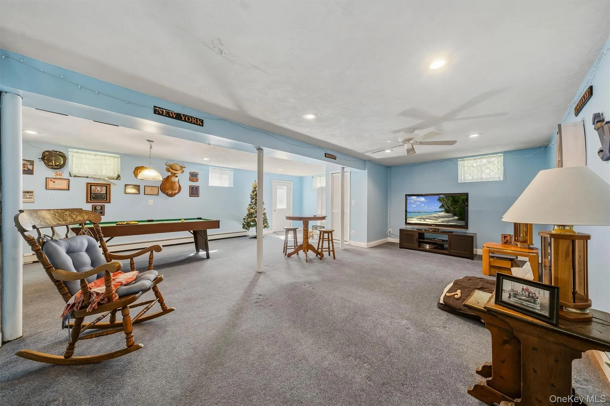 Spacious finished basement with recessed lighting, ceiling fan, and carpeted flooring Spacious finished basement with recessed lighting, ceiling fan, and carpeted flooring