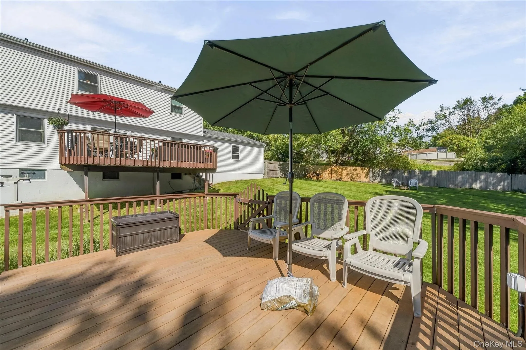 Expansive wood deck with a full railing system Expansive wood deck with a full railing system