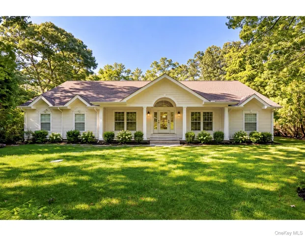 Front of home virtually updated with trees removed and refreshed landscaping