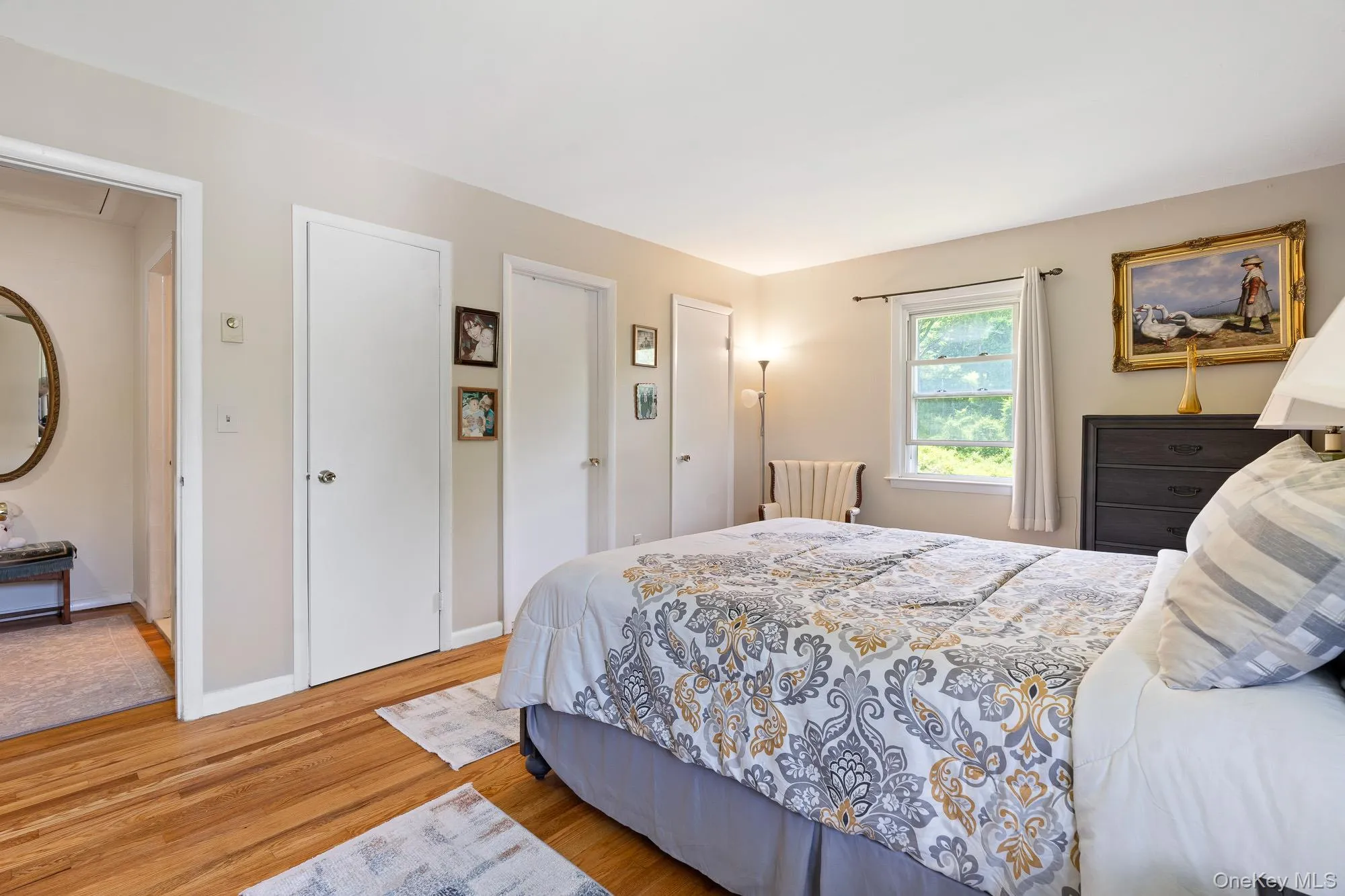 Bedroom with wood finished floors and baseboards Bedroom with wood finished floors and baseboards