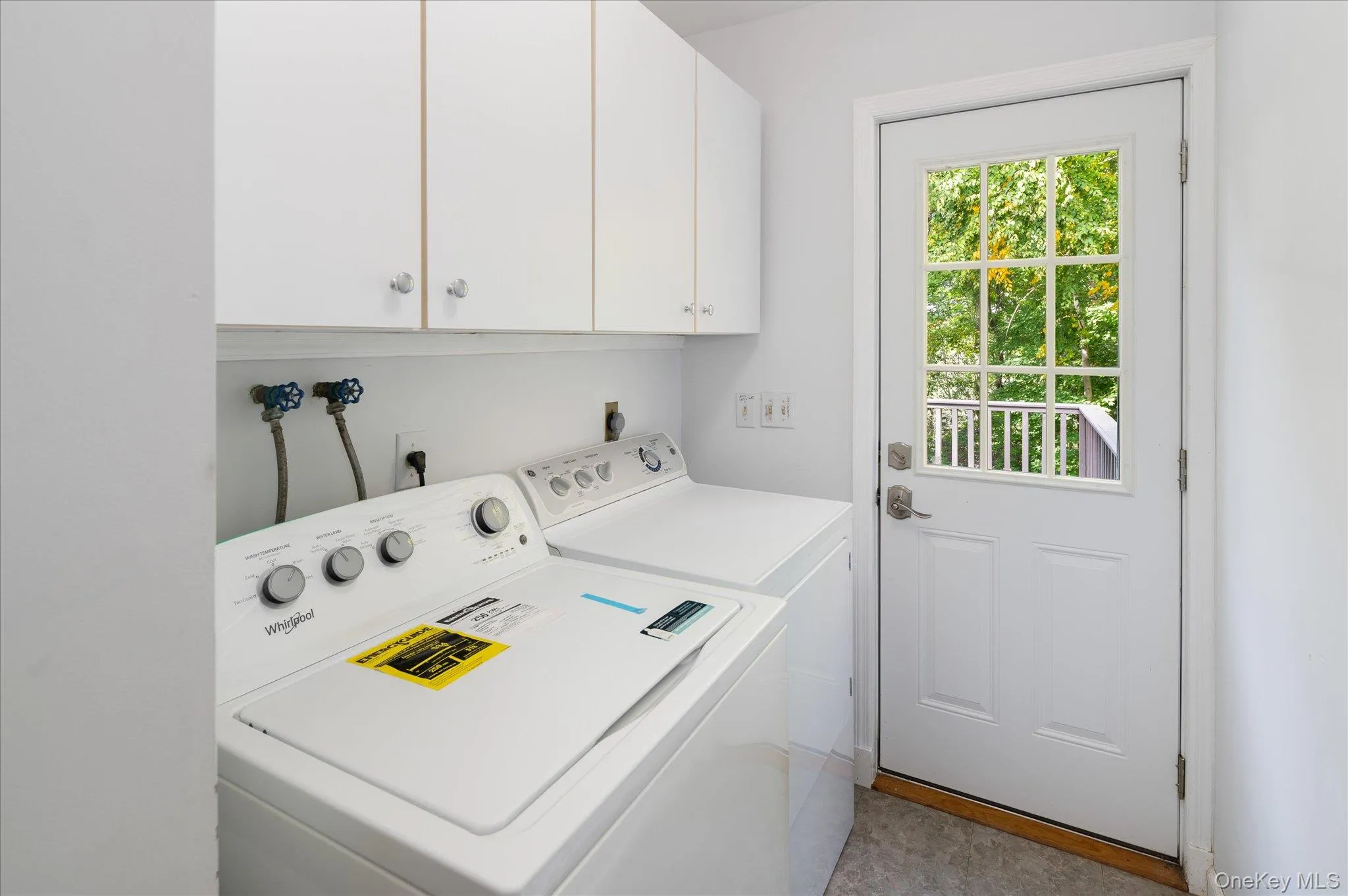 Main level laundry room with door to deck Main level laundry room with door to deck