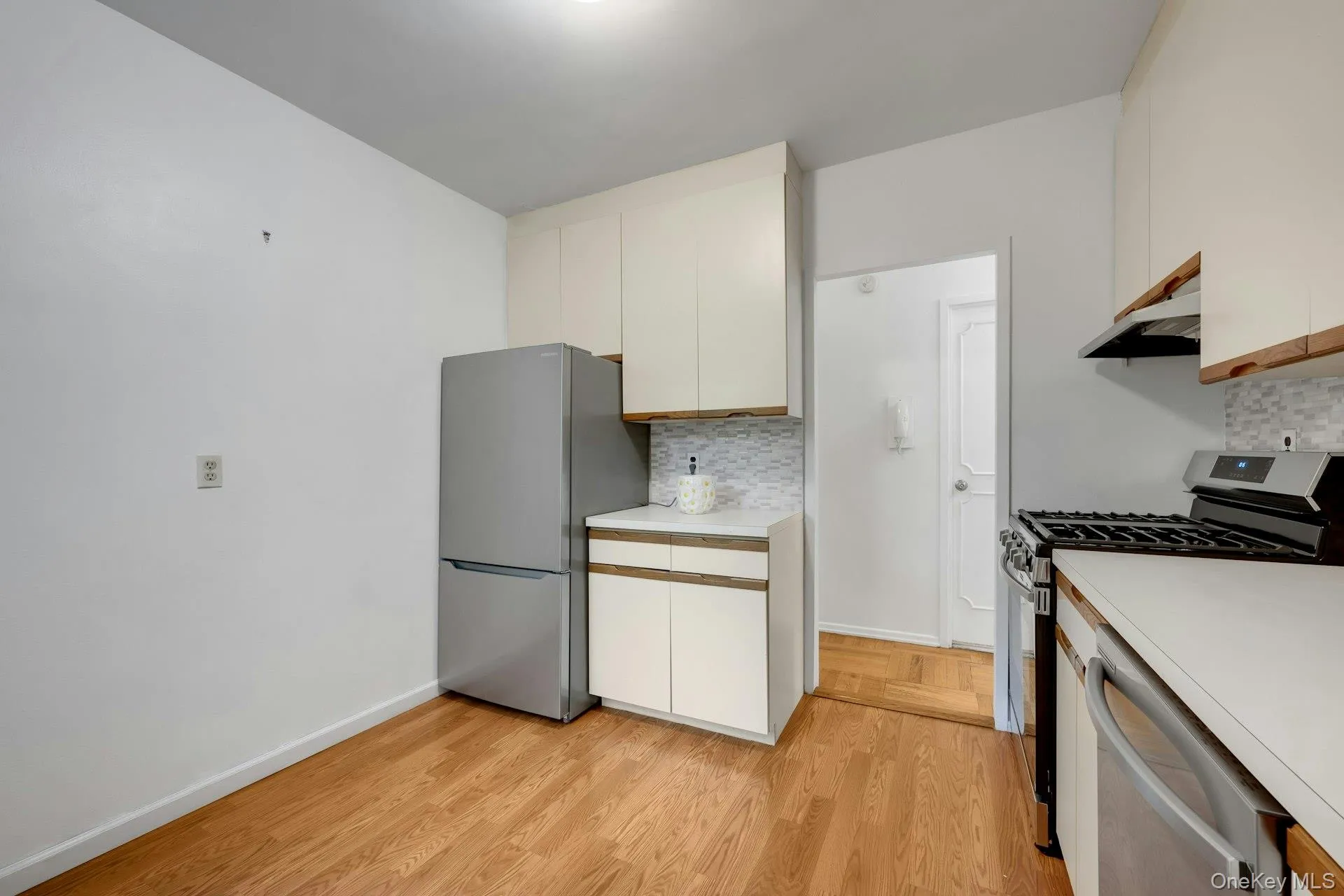 Kitchen with stainless steel appliances. Kitchen with stainless steel appliances.
