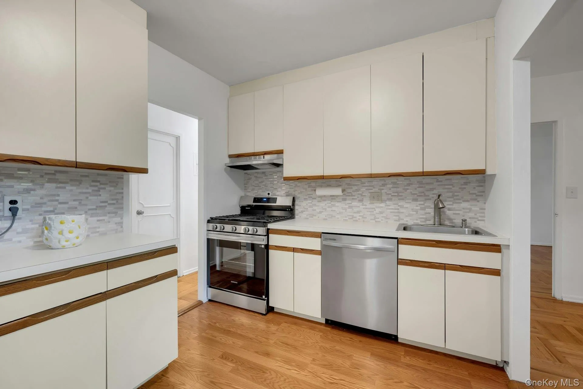 Stainless Steel appliances and tiled backsplash. Stainless Steel appliances and tiled backsplash.