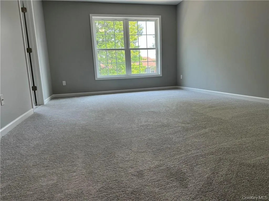 View of carpeted empty room View of carpeted empty room