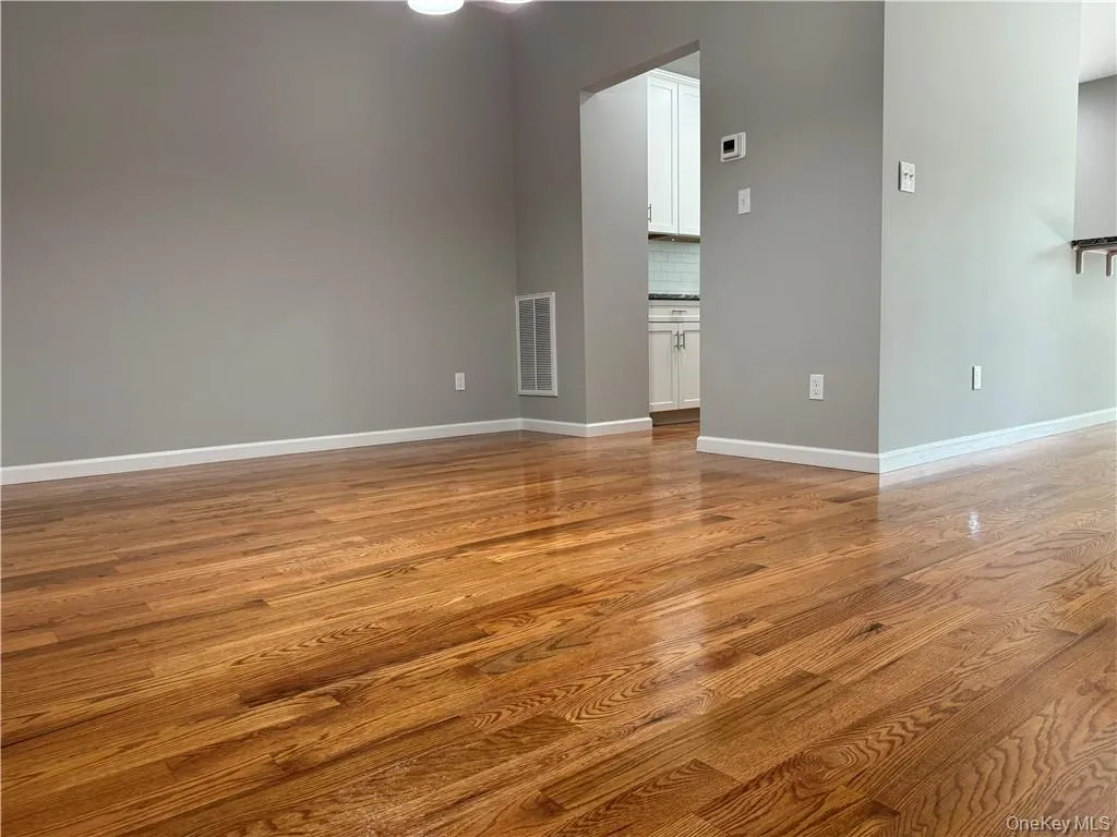 Unfurnished room featuring light hardwood / wood-style floors Unfurnished room featuring light hardwood / wood-style floors