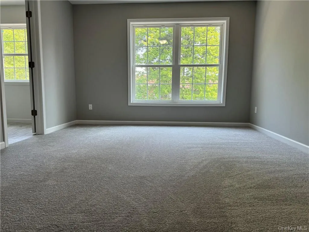 View of carpeted empty room View of carpeted empty room