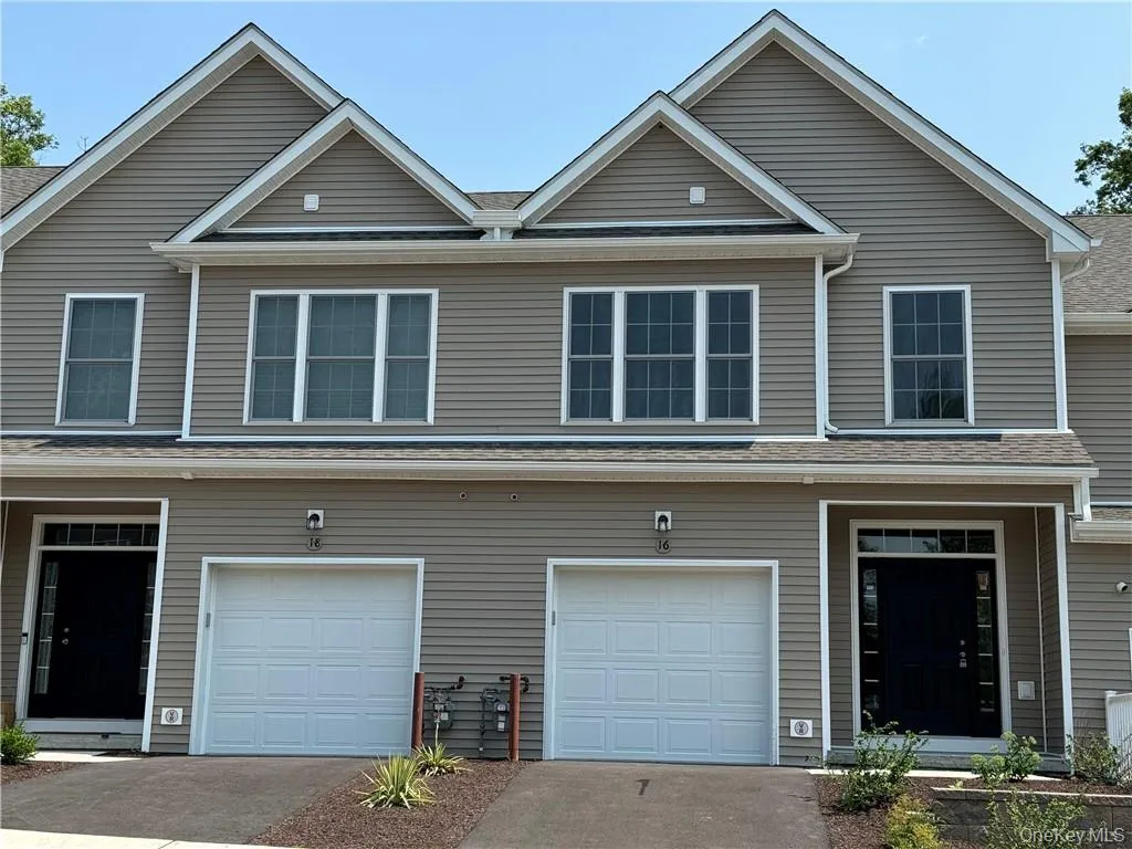 View of front of home featuring a garage View of front of home featuring a garage