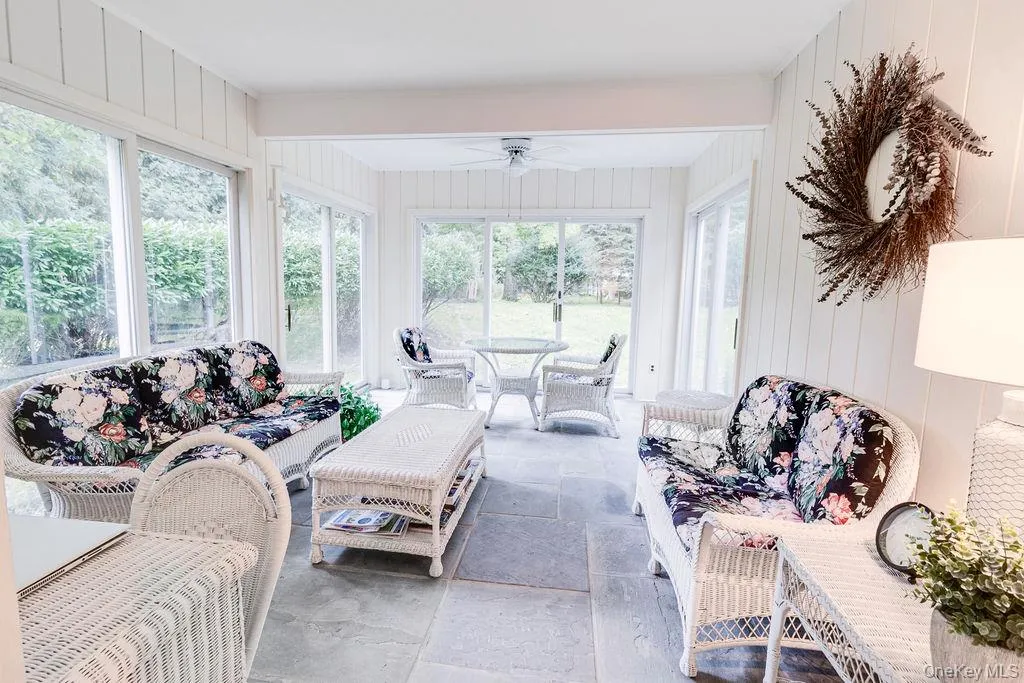Beautiful, heated sunroom with slate flooring and 4 sliding glass doors Beautiful, heated sunroom with slate flooring and 4 sliding glass doors
