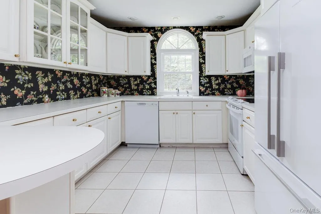 Bright kitchen with newer appliances and counter seating Bright kitchen with newer appliances and counter seating