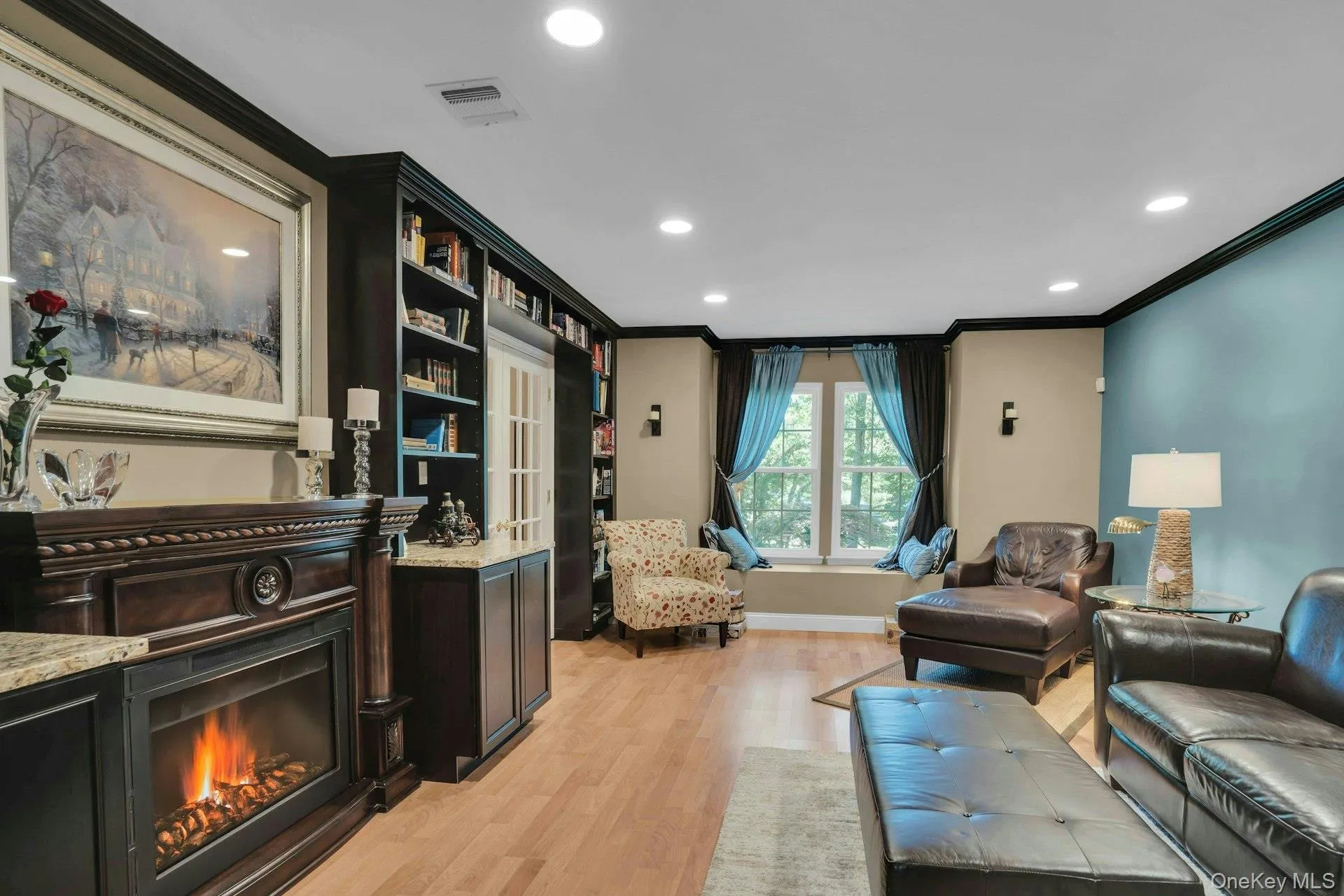 Cozy fireplace completes the sense and feel of the library. Cozy fireplace completes the sense and feel of the library.