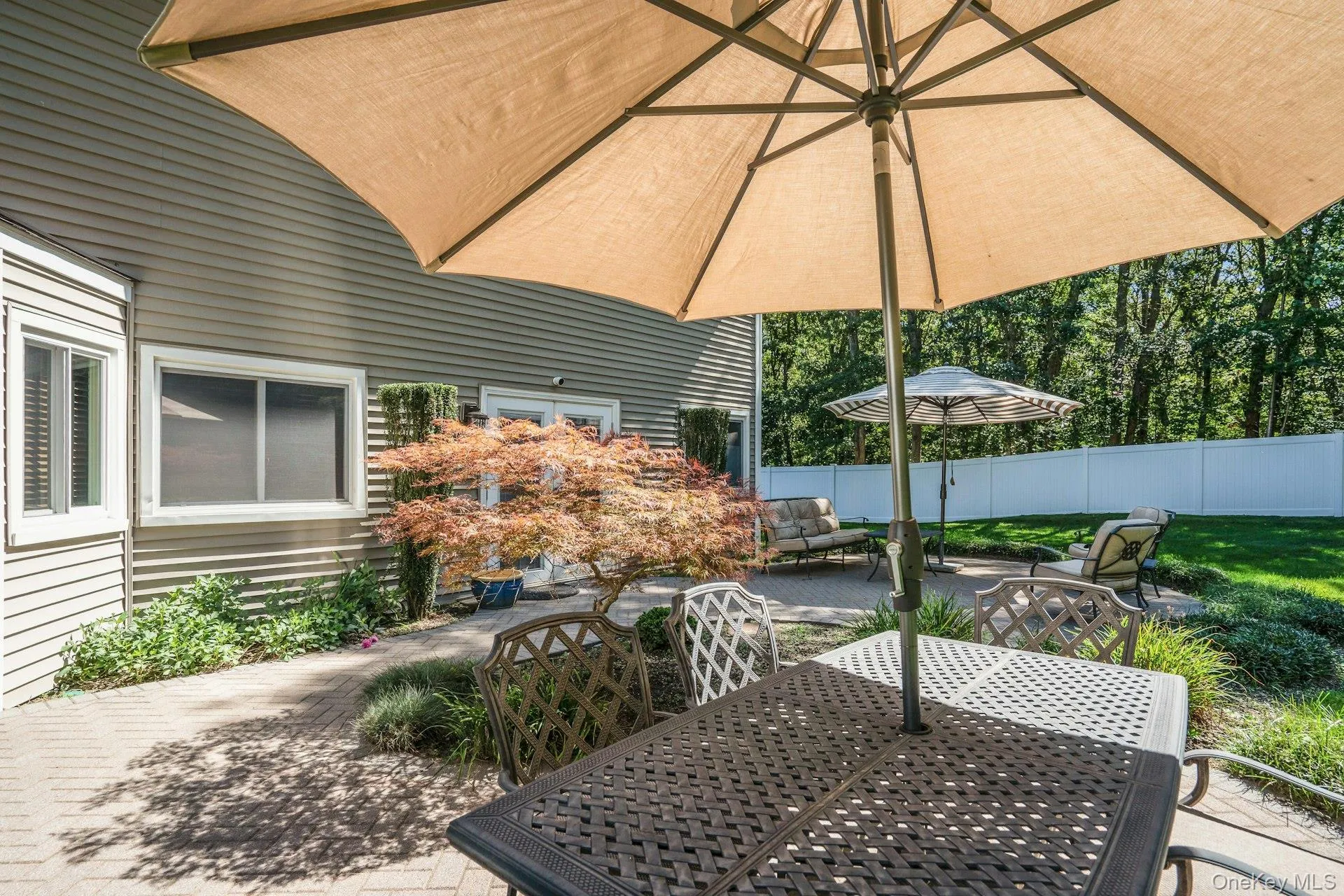 Patio runs the length of the house. Patio runs the length of the house.