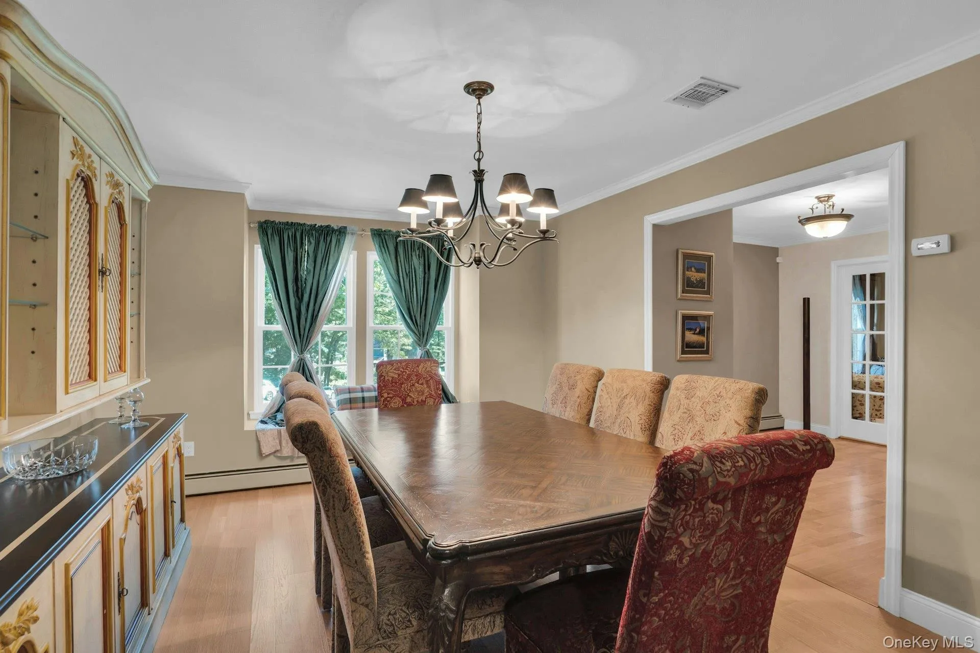 Formal dining room with window seat. Formal dining room with window seat.