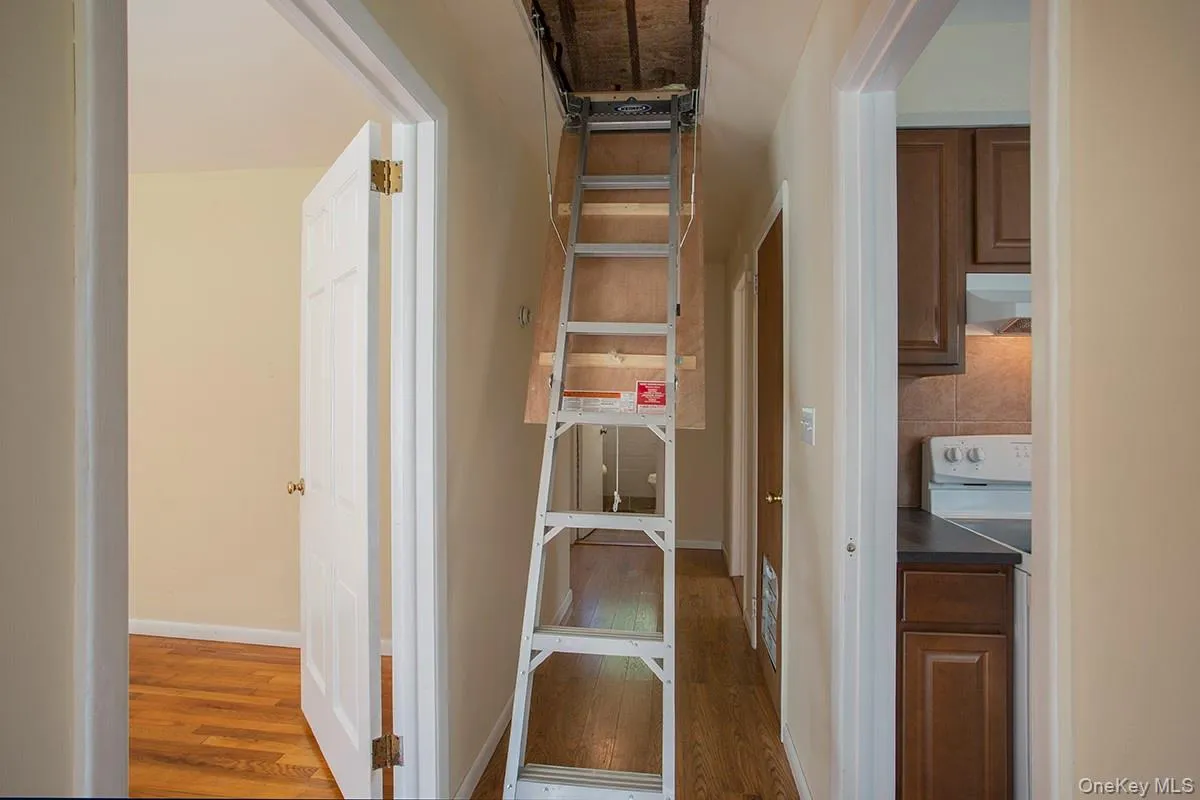 Hallway with Pull-Down stairs to attic Hallway with Pull-Down stairs to attic