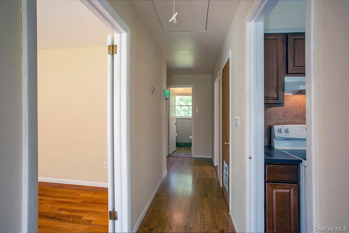 Hardwood-style flooring throughout the hallway Hardwood-style flooring throughout the hallway