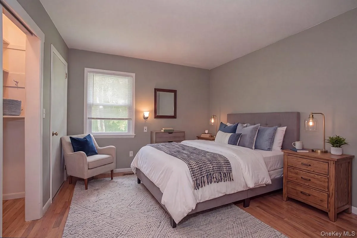 Bedroom 1Virtually Staged; Furniture digitally added.Hardwood-style flooring throughout Bedroom 1Virtually Staged; Furniture digitally added.Hardwood-style flooring throughout