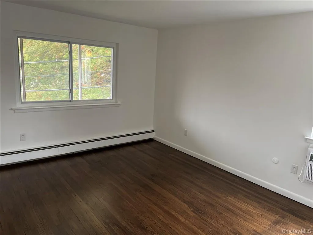 Large bedroom with two windows and double closet Large bedroom with two windows and double closet
