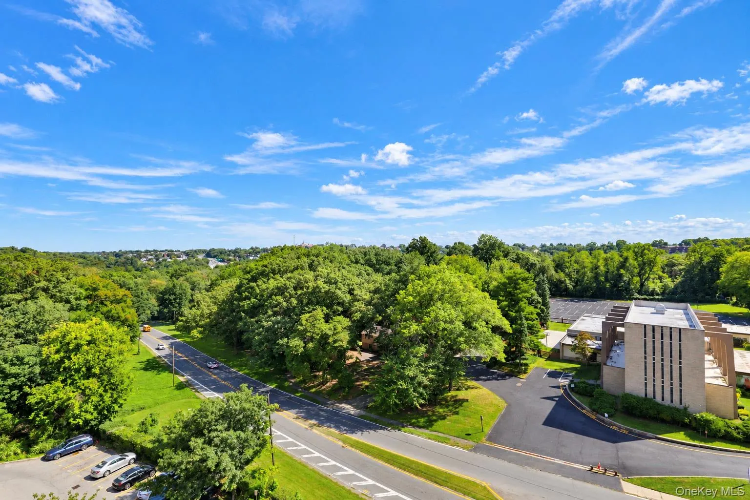 Extensive natural landscaping with mature trees and paved roadways Extensive natural landscaping with mature trees and paved roadways