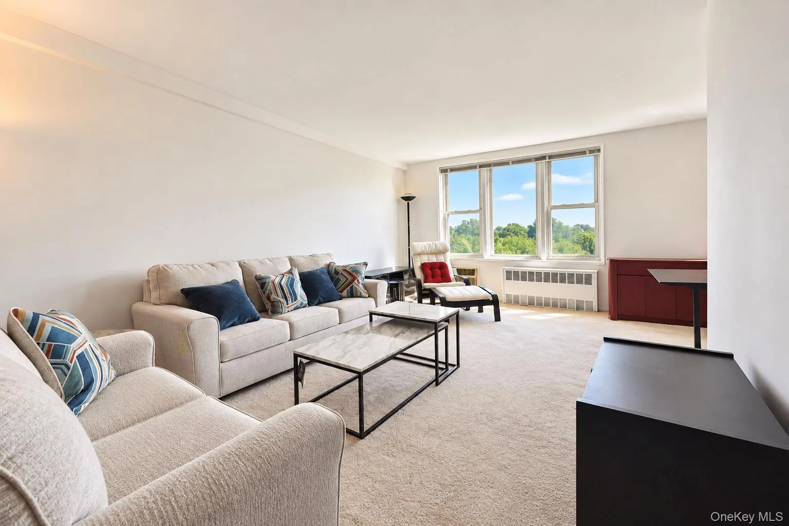 Wall-to-wall carpeting, multiple large windows, and crown molding Wall-to-wall carpeting, multiple large windows, and crown molding
