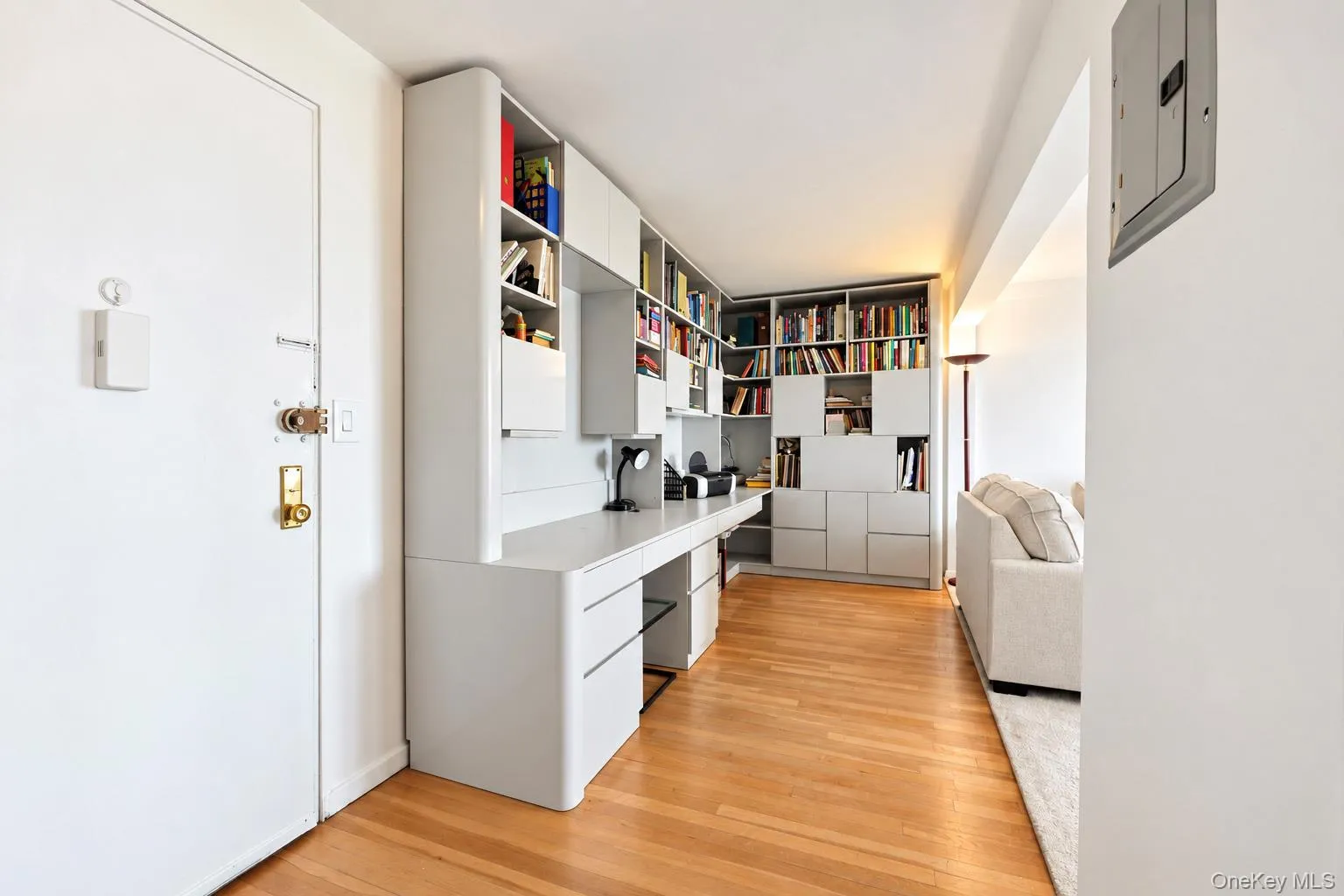 Wood-finish flooring, built-in desk, and integrated shelving Wood-finish flooring, built-in desk, and integrated shelving