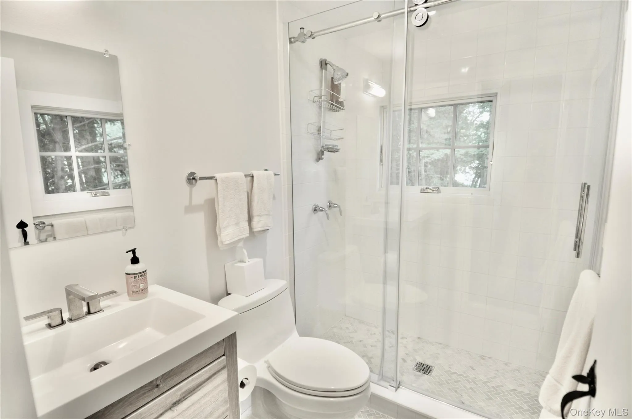 Full bath with a shower stall, vanity, and toilet Full bath with a shower stall, vanity, and toilet