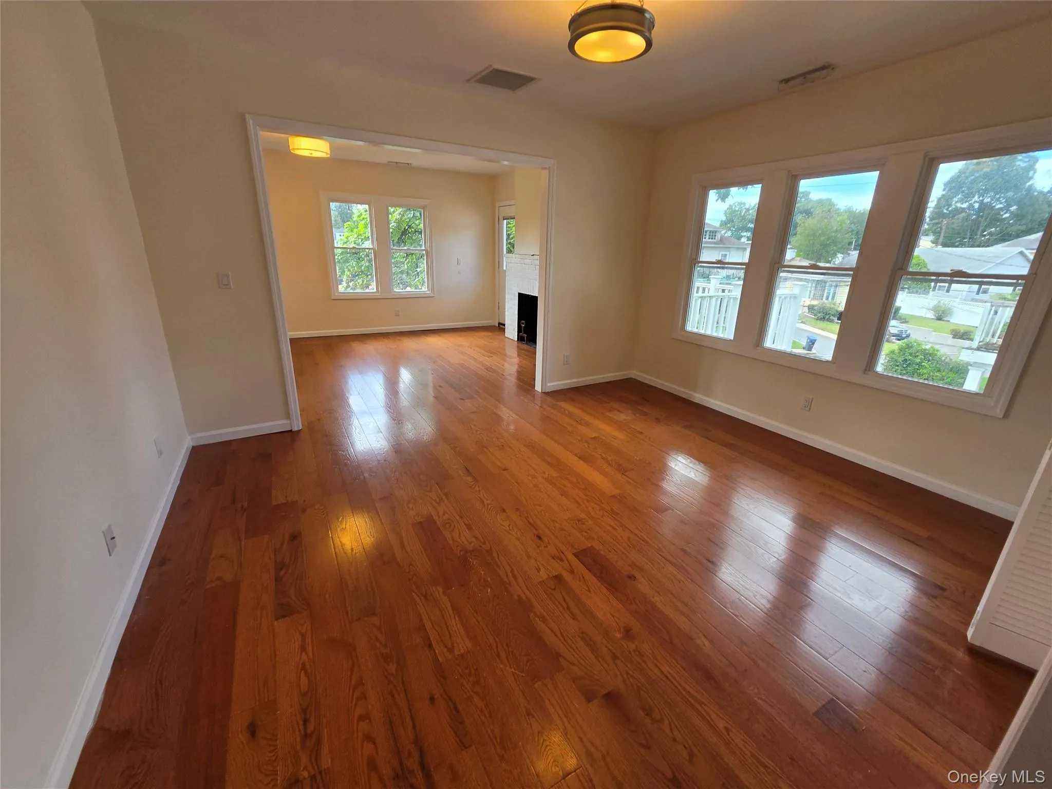 Hardwood flooring throughout, multiple windows, recessed lighting, and a white trim package Hardwood flooring throughout, multiple windows, recessed lighting, and a white trim package