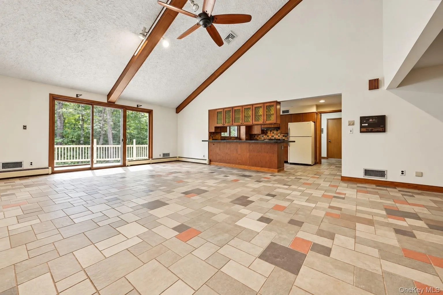 Sliding glass doors to new deck, open to kitchen, cathedral ceiling Sliding glass doors to new deck, open to kitchen, cathedral ceiling
