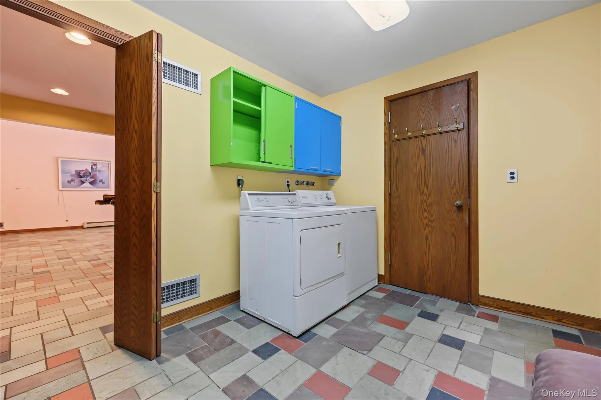 Laundry room behind the kitchen. Door on right is the powder room Laundry room behind the kitchen. Door on right is the powder room